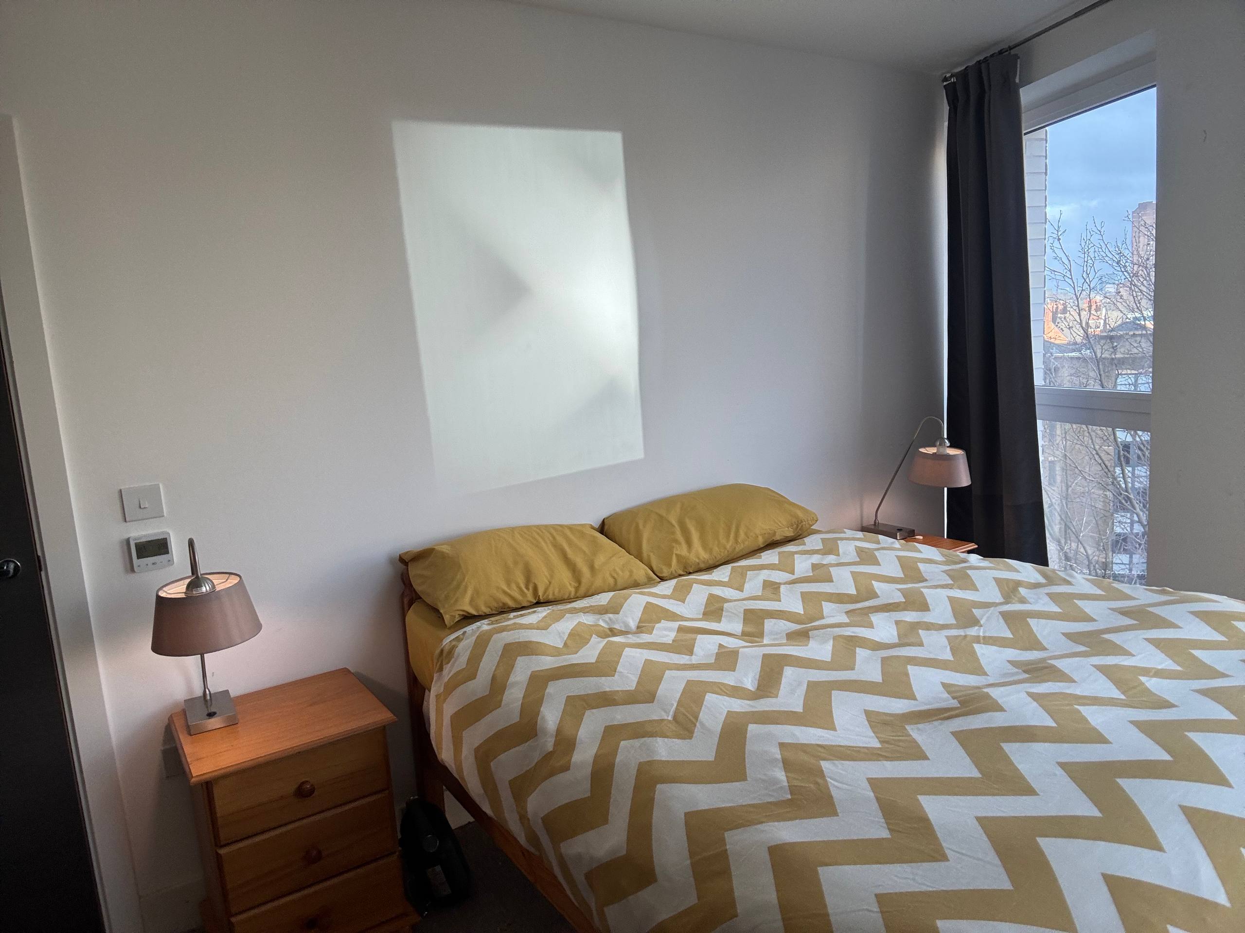 Empty wall above the bed